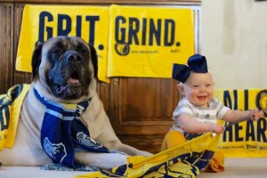 Grizz, the English Mastiff, and Addison Grimes of East Memphis cheering on their favorite team! 
